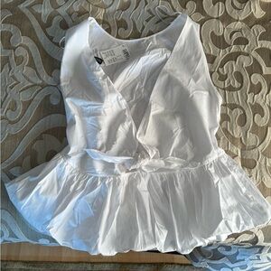 White peplum blouse with tie in front